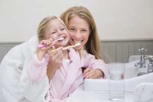 mother daughter brushing together