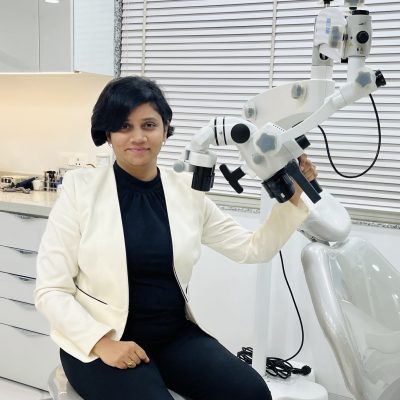 DR Pranjal with dental microscope